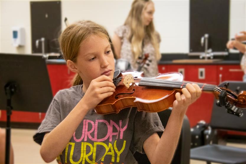 A girl plays the violin